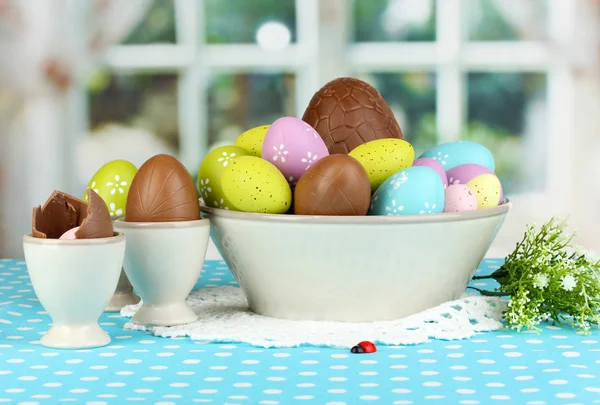 Composition of Easter and chocolate eggs on window background — Stock Photo, Image