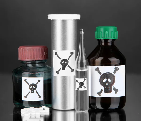 Deadly poison in bottles on black background — Stock Photo, Image