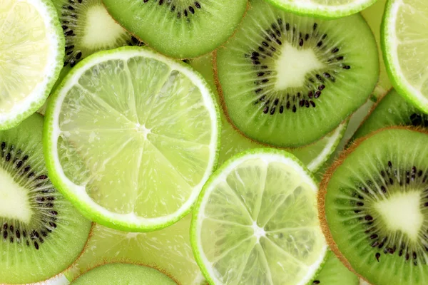 Kiwi and lime slices background — Stock Photo, Image