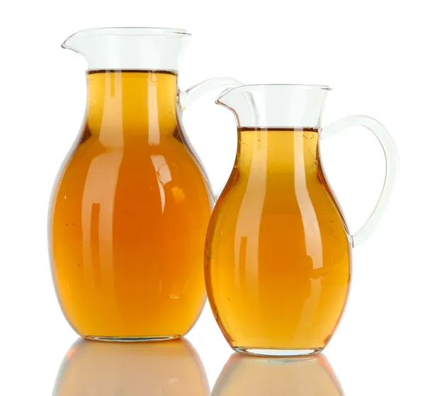 Apple juice in pitchers isolated on white — Stock Photo, Image