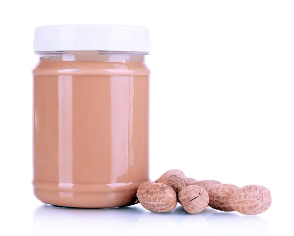 Delicious peanut butter in jar of peanut near isolated on white — Stock Photo, Image