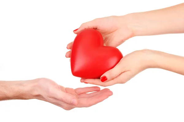 Red heart in woman and man hands, isolated on white — Stock Photo, Image