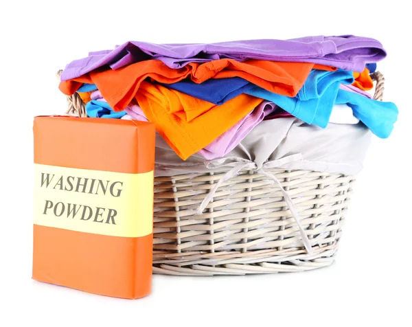 Clothes with washing powder in wooden basket isolated on white — Stock Photo, Image