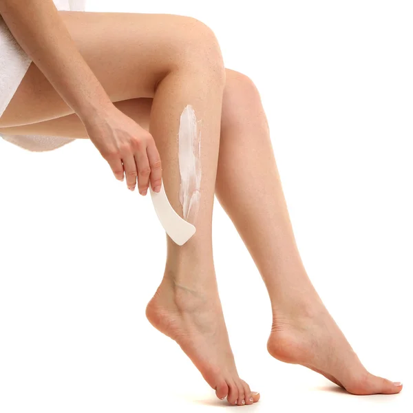 Bella donna gambe con crema depilatoria, isolato su bianco — Foto Stock