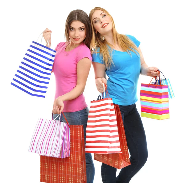 Dva přátelé dívka s nákupy, izolované na bílém — Stock fotografie