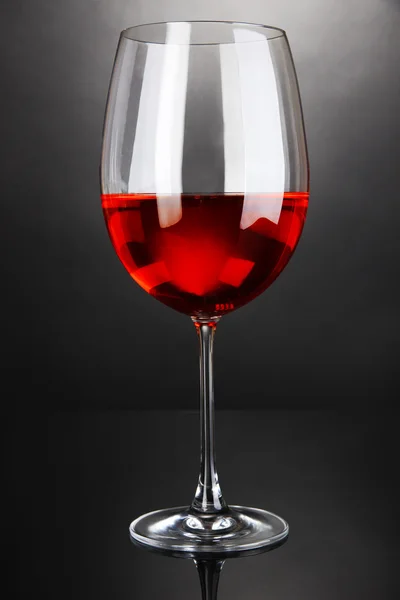 Red wine glass on grey background — Stock Photo, Image