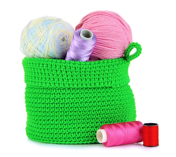 Colorful yarn for knitting in green basket isolated on white — Stock Photo, Image