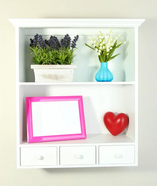 Beautiful white shelves with different home related objects — Stock Photo, Image