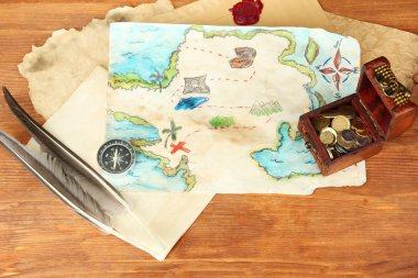 map of treasures on wooden background clipart