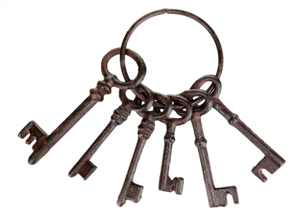 Gäng gamla nycklar isolerad på vit — Stockfoto
