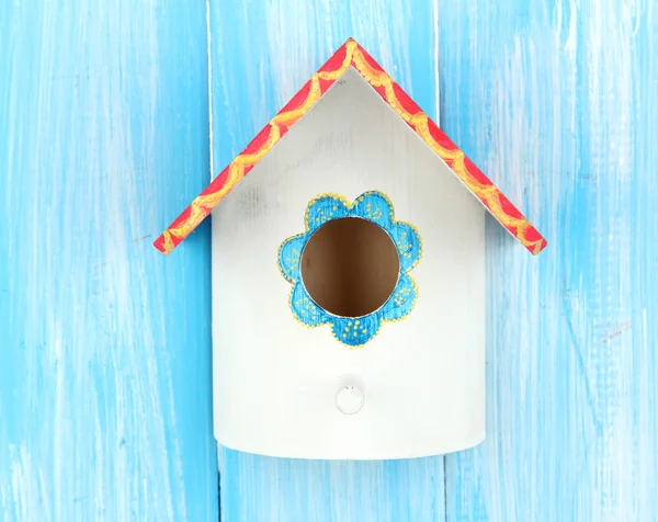 Decorative nesting box on color background — Stock Photo, Image