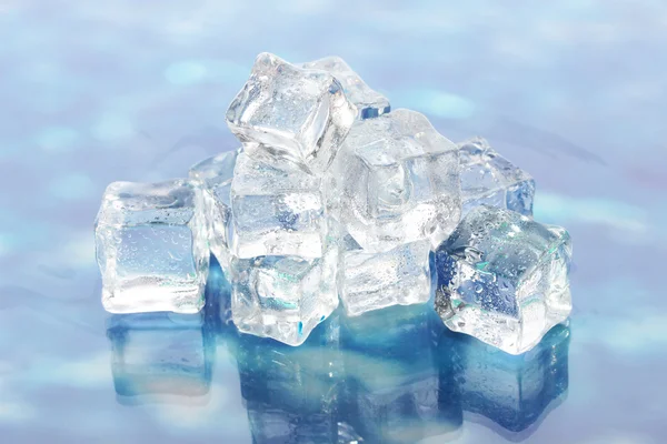 Ice cubes on the background water — Stock Photo, Image