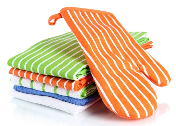 Orange potholder and stack of kitchen towels isolated on white — Stock Photo, Image