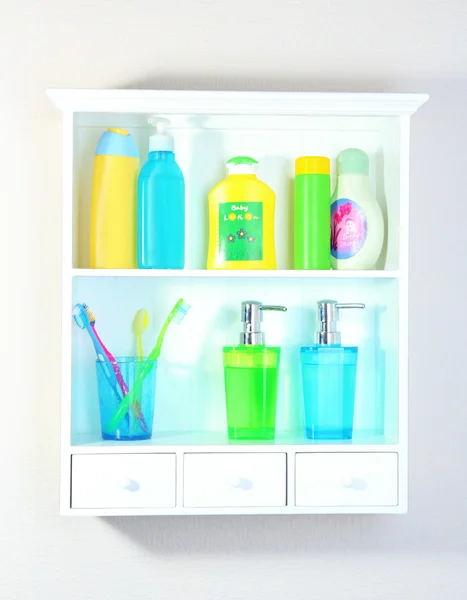 Beautiful white shelves with different bathroom objects — Stock Photo, Image