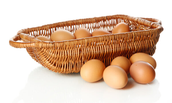 Many eggs in basket isolated on white