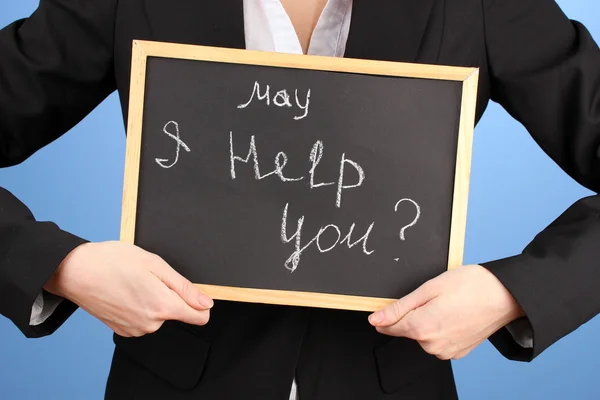 Young woman holding sign May I help you? — Stock Photo, Image