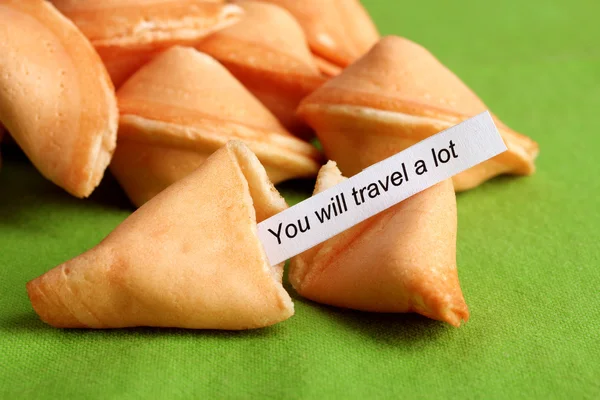 Fortune cookies on green tablecloth — Stock Photo, Image