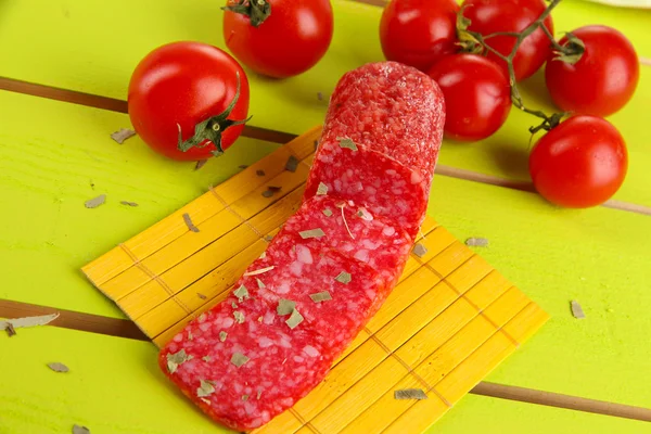Tasty salami on wooden table close-up — Stock Photo, Image