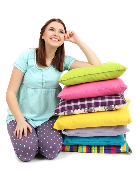 Beautiful young girl with pillows isolated on whit — Stock Photo, Image