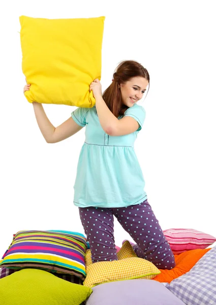 Beautiful young girl with pillows isolated on whit — Stock Photo, Image