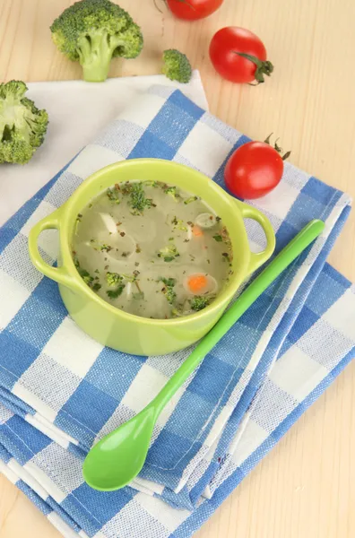 Diet soup with vegetables in pan on wooden table close-up — Stock Photo, Image