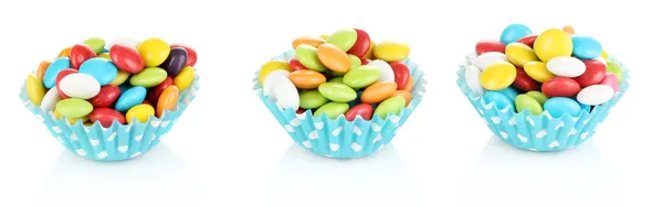 Colorful candies in cupcake cases isolated on white — Stock Photo, Image