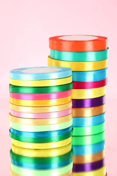 Bright ribbons on pink background — Stock Photo, Image