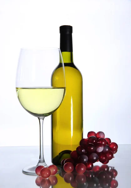 White wine glass and bottle of wine isolated on white — Stock Photo, Image