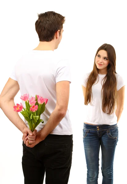 Pareja cariñosa con tulipanes aislados en blanco — Foto de Stock