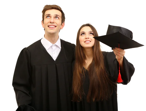 Due felici studenti laureati isolati su bianco — Foto Stock