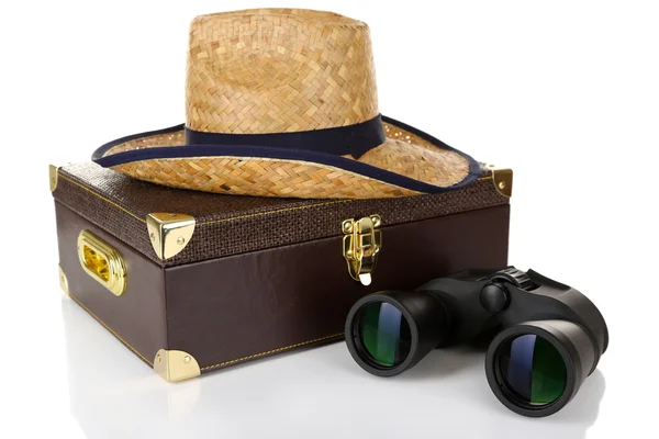 Black modern binoculars with suitcase and straw hat isolated on white — Stock Photo, Image