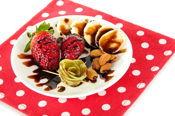 Fruta en chocolate en una servilleta roja lunares —  Fotos de Stock