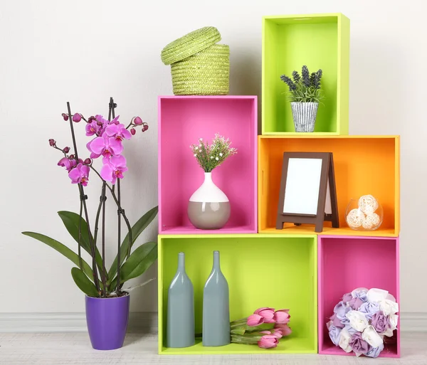Beautiful colorful shelves with different home related objects — Stock Photo, Image