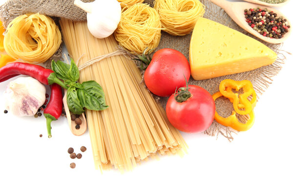 Pasta spaghetti, vegetables and spices, isolated on white