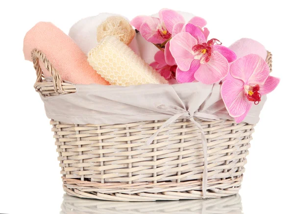 Bathroom towels folded in wicker basket isolated on white — Stock Photo, Image