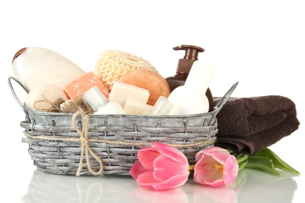 Composition of cosmetic bottles and soap in basket, isolated on white — Stock Photo, Image