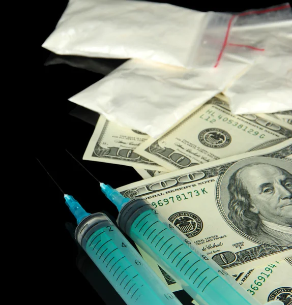 Drugs, money and syringes, isolated on black — Stock Photo, Image