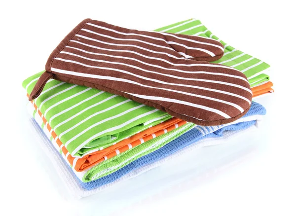 Brown potholder and stack of kitchen towels isolated on white — Stock Photo, Image
