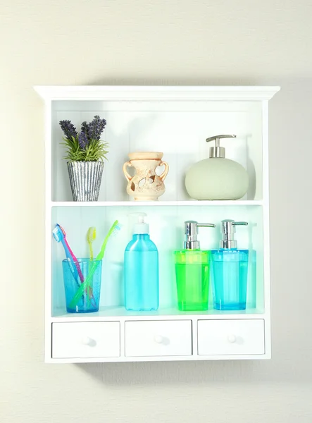 Beautiful white shelves with different bathroom objects — Stock Photo, Image