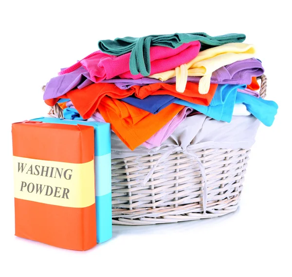 Clothes with washing powder in wooden basket isolated on white — Stock Photo, Image