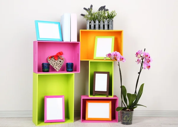 Beautiful colorful shelves with different home related objects — Stock Photo, Image