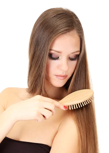 Portrait of beautiful woman brushing her hair, isolated on white — Stock Photo, Image