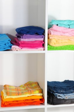 Clothes neatly folded on shelves
