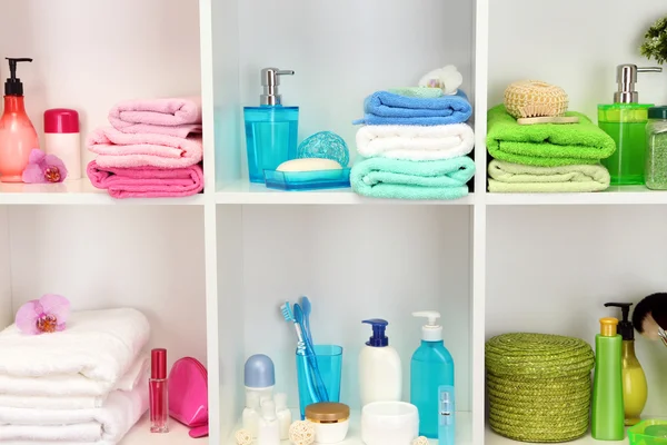 Bath accessories on shelfs in bathroom — Stock Photo, Image