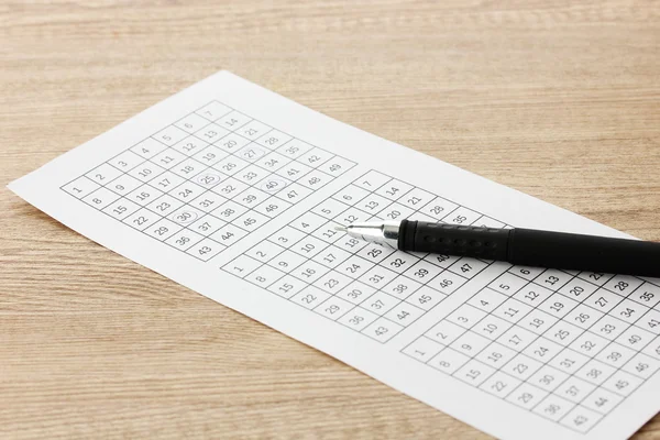 Lottery ticket and pen, on wooden background — Stock Photo, Image