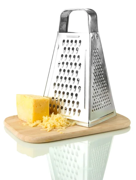 Metal grater and cheese on cutting board, isolated on white — Stock Photo, Image