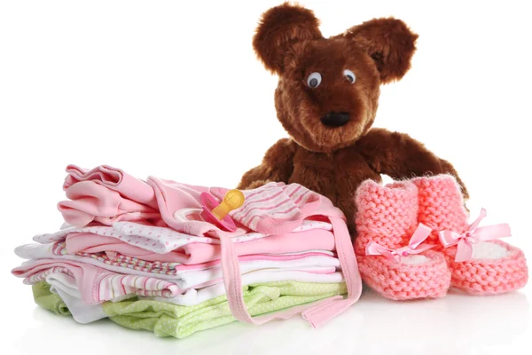 Pilha de roupas de bebê isoladas em branco — Fotografia de Stock