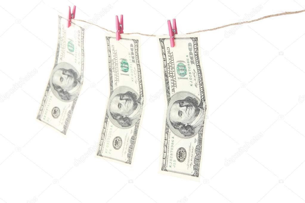 Paper money on rope isolated on white
