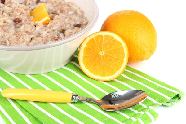 Harina de avena útil en tazón con fruta aislada en blanco —  Fotos de Stock