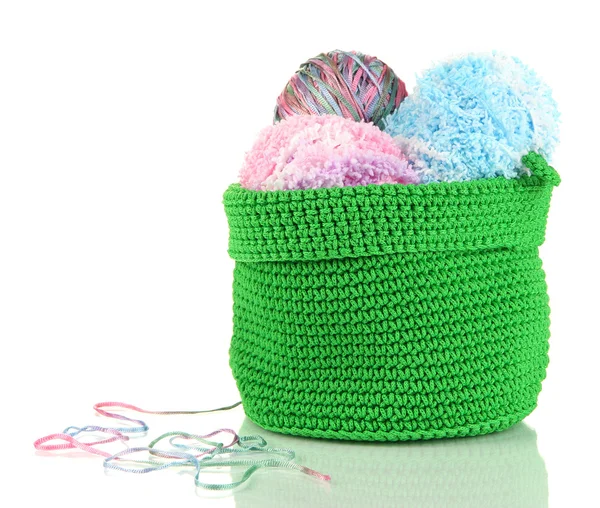 Colorful yarn for knitting in green basket isolated on white — Stock Photo, Image